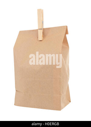 Old-fashied lunch bag with wooden clothes pin on white background Stock Photo