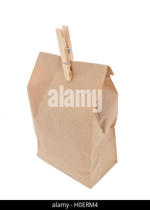 Old-fashied lunch bag with wooden clothes pin 2 on white background Stock Photo