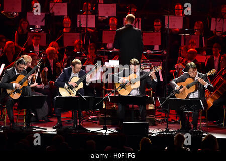Aquarelle Guitar Quartet perform with the Academy of St Martin in the Fields Orchestra, conducted by Timothy Henty at Classic FM Live at the Royal Albert Hall in London. The Concert is hosted by the UK's most popular classical music station, Classic FM. PRESS ASSOCIATION Photo. Picture date: Tuesday September 20, 2016. Photo credit should read: Matt Crossick/PA Wire Stock Photo
