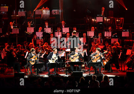 Aquarelle Guitar Quartet perform with the Academy of St Martin in the Fields Orchestra, conducted by Timothy Henty at Classic FM Live at the Royal Albert Hall in London. The Concert is hosted by the UK's most popular classical music station, Classic FM. PRESS ASSOCIATION Photo. Picture date: Tuesday September 20, 2016. Photo credit should read: Matt Crossick/PA Wire Stock Photo