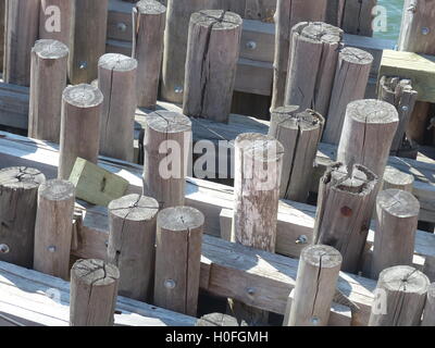 Pressure treated wood pillars of Staten Island Ferry docks Stock Photo