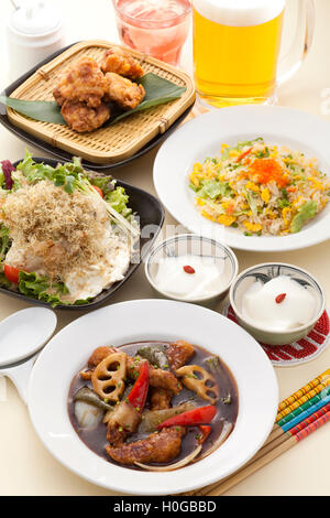 Tofu and small fish sesame fragrant salad Dim Sumwith small basket parcel, shrimp dumplings, fried spring rolls and snacks meal Stock Photo