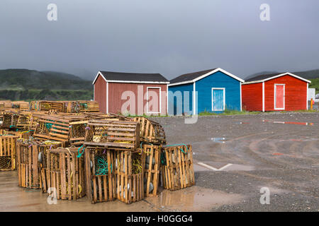 Colorful fishing stages and lobster traps in Trout river, Newfoundland and Labrador, Canada. Stock Photo