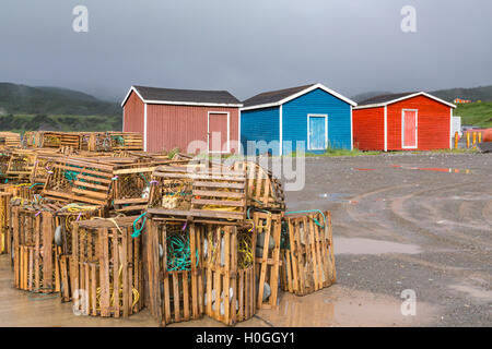 Colorful fishing stages and lobster traps in Trout river, Newfoundland and Labrador, Canada. Stock Photo