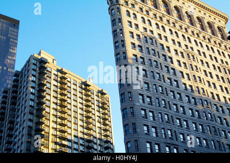 Dramatic Angled Front Facade of Flatiron Building with Sunrise in Manhattan, New York City, NY, USA. Elevation Shot. Stock Photo