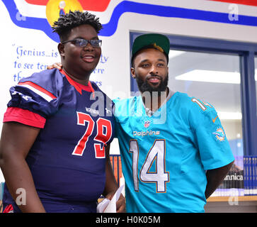 Miami, FL, USA. 20th Sep, 2016. Stephen Gordon and Miami Dolphins Wide Receiver (#14) Jarvis Landry surprise the Miramar Patriots varsity football team prior to the team's practice as part of the 4 Downs for Finance financial literacy program sponsored by BankUnited. Landry share his thoughts on the importance of financial literacy at Miramar High School Media Center on September 20, 2016 in Miramar, Florida. Credit:  Mpi10/Media Punch/Alamy Live News Stock Photo