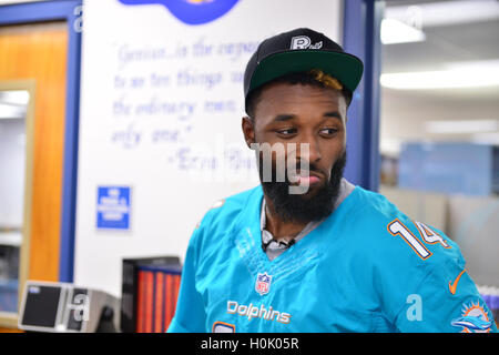 Miami, FL, USA. 20th Sep, 2016. Miami Dolphins Wide Receiver (#14) Jarvis Landry surprise the Miramar Patriots varsity football team prior to the team's practice as part of the 4 Downs for Finance financial literacy program sponsored by BankUnited. Landry share his thoughts on the importance of financial literacy at Miramar High School Media Center on September 20, 2016 in Miramar, Florida. Credit:  Mpi10/Media Punch/Alamy Live News Stock Photo