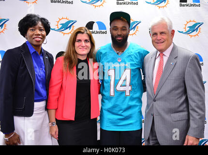 MIAMI, FL - SEPTEMBER 20: BankUnited Vice President of Community Development & Outreach Katrina Wright, Miramar High School Principal Maria Formoso, Miami Dolphins Wide Receiver (#14) Jarvis Landry and BankUnited Senior Executive Vice President Gerry Litrento surprise the Miramar Patriots varsity football team prior to the team's practice as part of the 4 Downs for Finance financial literacy program sponsored by BankUnited. Landry share his thoughts on the importance of financial literacy at Miramar High School Media Center on September 20, 2016 in Miramar, Florida. Credit: MPI10/MediaPunch Stock Photo