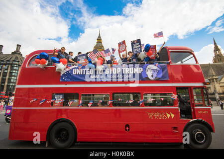 London, UK. 21st Sep, 2016. London, September 21st 2016. A 'Stop Trump' open topped red London double-decker bus passes the Houses of Parliament and Big Ben in London in a bid to encourage US expats to register to vote in the Presidential election, expecting the majority of them to be more inclined to support Hilary Clinton. Credit:  Paul Davey/Alamy Live News Stock Photo