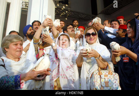 Women activists of Awami National Party (ANP) are freeing pigeons as they are marking Peace Day, during the demonstration in connection of International Day of Peace held at Bacha Khan Markaz in Peshawar on Wednesday, September 21, 2016. Stock Photo