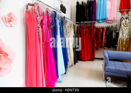 Evening dresses on hangers in store Stock Photo
