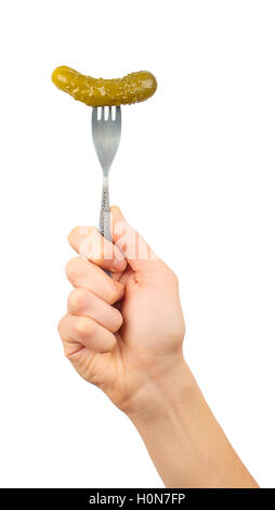Men's hand holding a fork with a salted cucumber isolated on white background Stock Photo