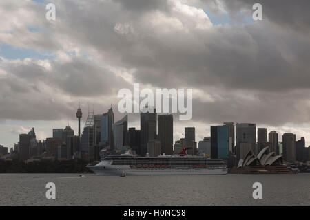 The Carnival Spirit Cruise Ship passes directly in front of the Sydney CBD as she departs Sydney Australia Stock Photo