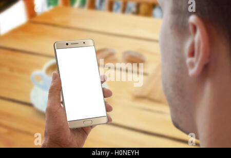 Man work on smart phone. Coffee on table in background. Stock Photo