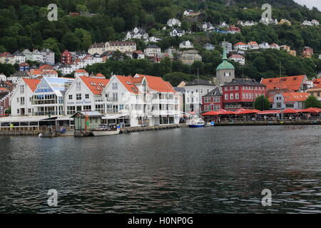 View over water to historic buildings in Vagen harbour area to Torget fish market, city of Bergen, Norway Stock Photo