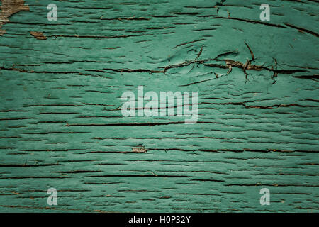Image of green wood background with cracked paint. Stock Photo