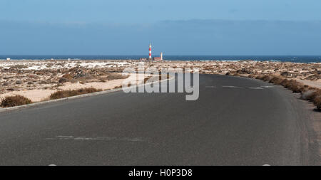 Fuerteventura: desert landscape and the road to the El Toston Lighthouse, whose original structure was opened in 1897 in the northwest of the island Stock Photo