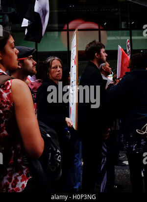 sullen, female protestor at anti-austerity march in London, stares at the camera Stock Photo