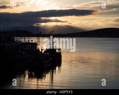 Sunset over the Mountains of Mull from Oban Harbour Argyll and Bute Scotland Stock Photo