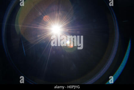 Natural lens flare on a dark background Stock Photo