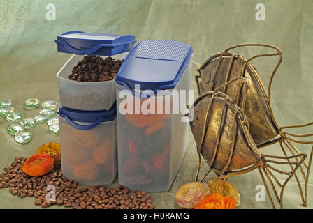 Coffee bean and dried fruit containers Stock Photo