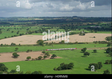 A Virgin Train travelling through the Cheshire countryside between Chester and Crewe