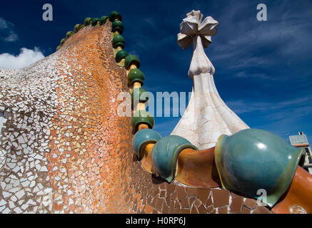 BARCELONA - SEPTEMBER 20: Rooftop of the house Casa Batllo designed by Antoni Gaudi. Ceramic tiles, with tower and bulb. Stock Photo