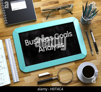 Business Goals Analysis - Text on Small Chalkboard. 3D. Stock Photo