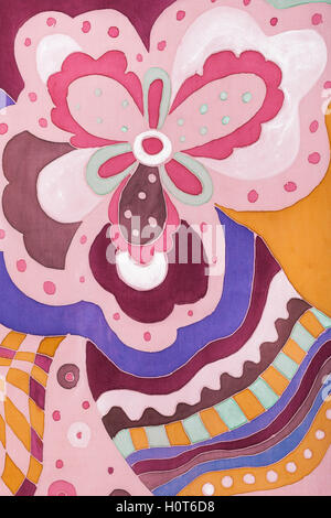 textile background - abstract pink and brown floral ornament on silk batik Stock Photo