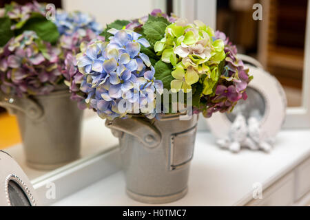 artificial bouquet flowers blue-yellow-green colors Stock Photo