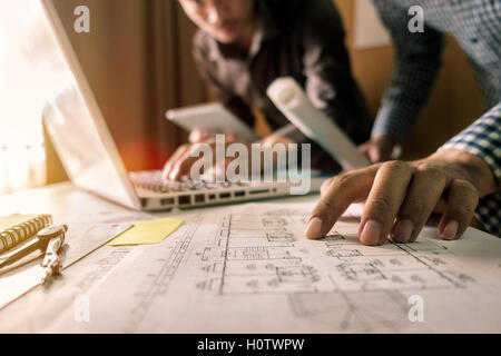 Business man hands using laptop and holding credit card with digital layer effect diagram as Online shopping concept Stock Photo