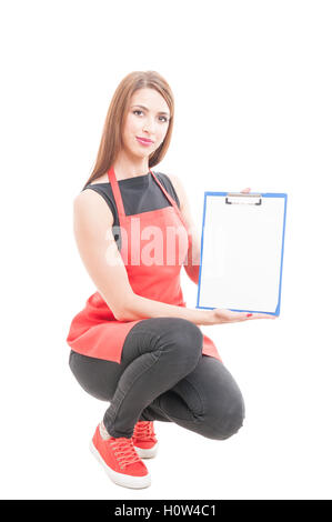 Beautiful female employee holding empty clipboard with advertising area isolated on white background Stock Photo