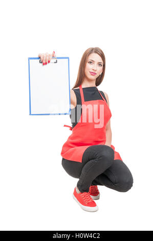 Supermarket retailer showing blank clipboard with copy space isolated on white studio background Stock Photo