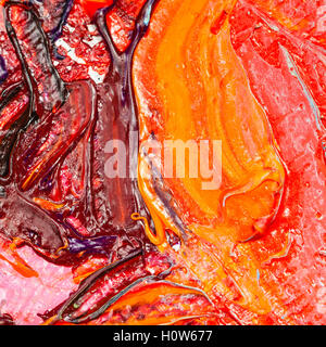 red and yellow oil paint brush strokes on canvas close up Stock Photo