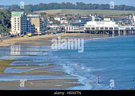 View from above British seaside beach holiday resort Sandown Pier Isle of Wight low tide sea breakwaters & groins England uk on blue sky day summer Stock Photo