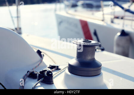 Grey winch on the white yacht without hawser Stock Photo