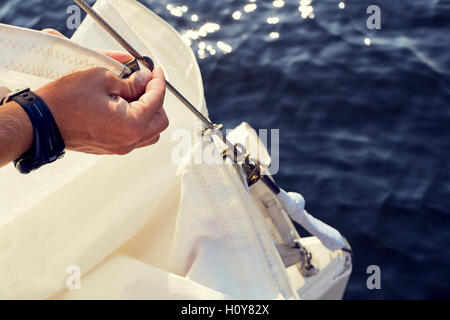 Preparing before lifting staysail sails. Stock Photo