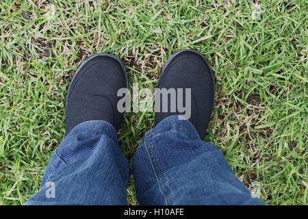 Black shoes on grassy background Stock Photo