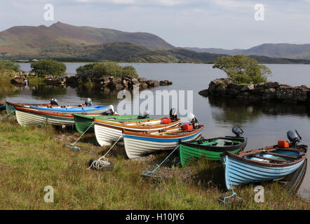 Sea trout fishing Ireland salmon fishing Ireland wooden fishing boats for game anglers on the shore of Lough Currane, County Kerry, Ireland. Stock Photo