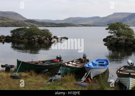 Sea trout fishing Ireland salmon fishing Ireland wooden fishing boats for game anglers on the shore of Lough Currane, County Kerry, Ireland. Stock Photo