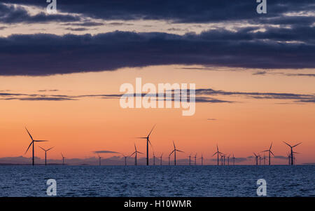 Sunrise over Walney Offshore Wind Farm off the Cumbrian Coast in the UK Stock Photo