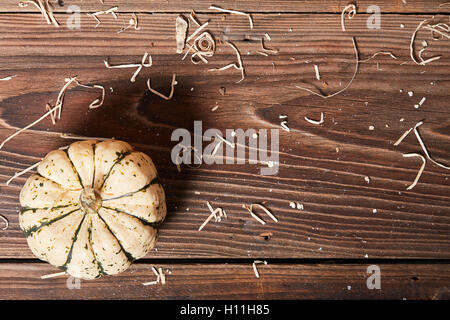 Pumpkin on a wooden table view from above Stock Photo