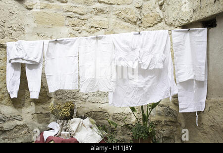 Towels lying on city street, fabrics and clothing Stock Photo