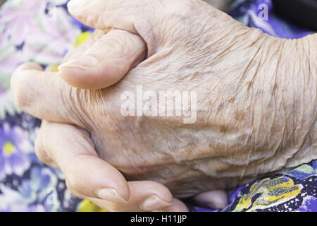 Old hands with wrinkles, aging and life Stock Photo