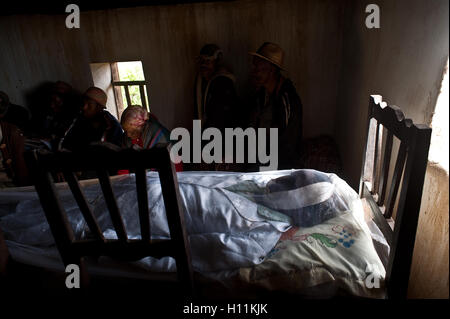 Dead body of an old woman in funeral held + bereaved relatives ( Madagascar) Stock Photo