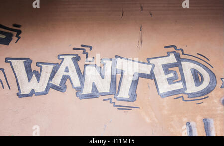 Drawn wanted poster on the wall, graffiti symbol Stock Photo