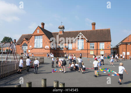 Children in playground, St Michael's Church of England Primary School, High St, Sunninghill, Berkshire, England, United Kingdom Stock Photo