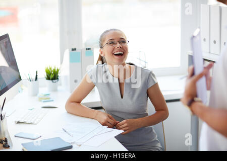 Laughing at joke Stock Photo
