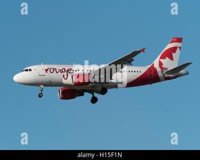 Air Canada rouge Airbus A319 C-FYJP low angle airborne profile jet plane Stock Photo