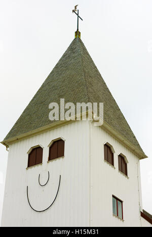 Skarhamn, Sweden - September 9, 2016: Environmental documentary of smiling church tower one misty morning in fall. Stock Photo